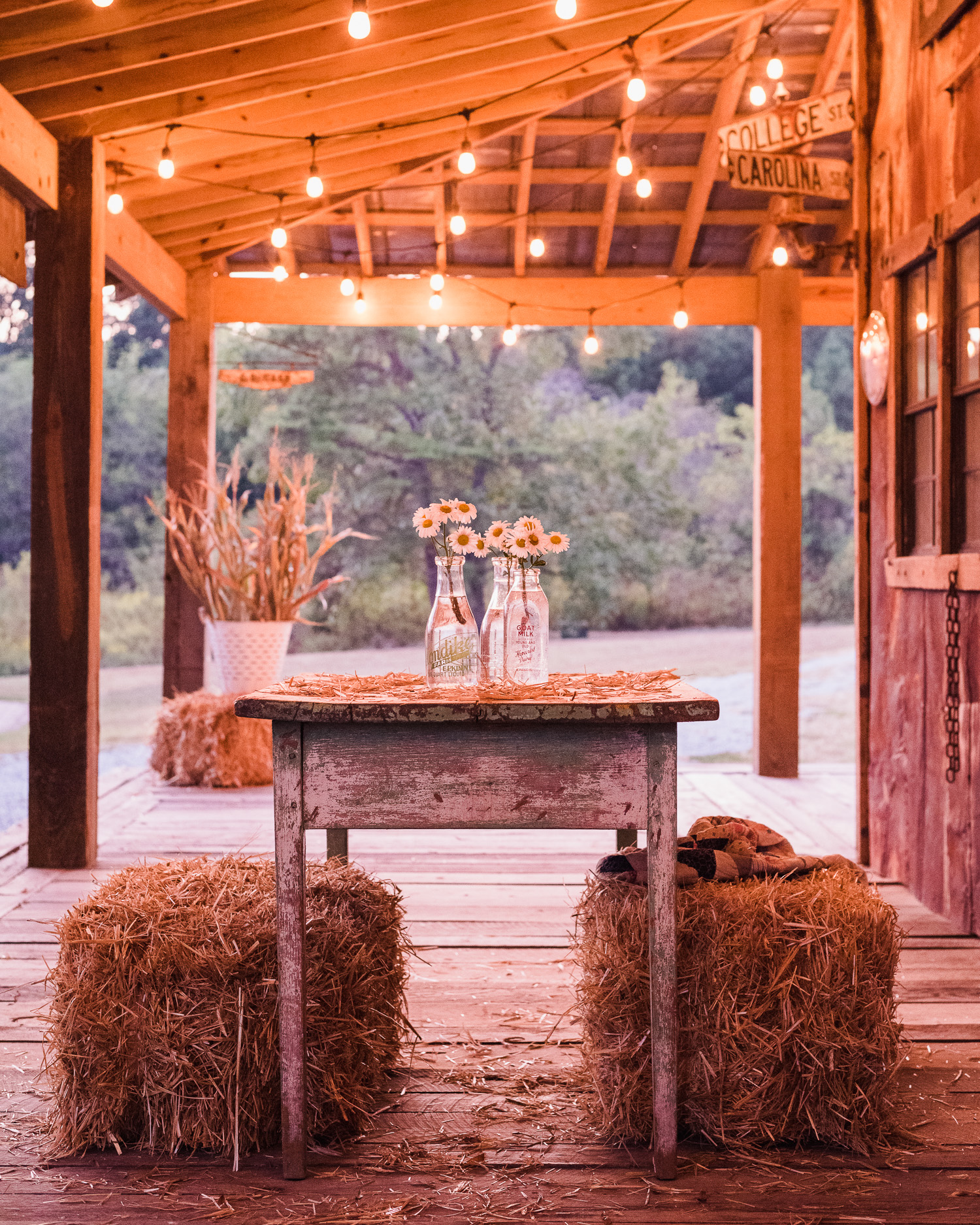 Decorating the barn porch for fall. Using vintage milk bottles found at a flea market.